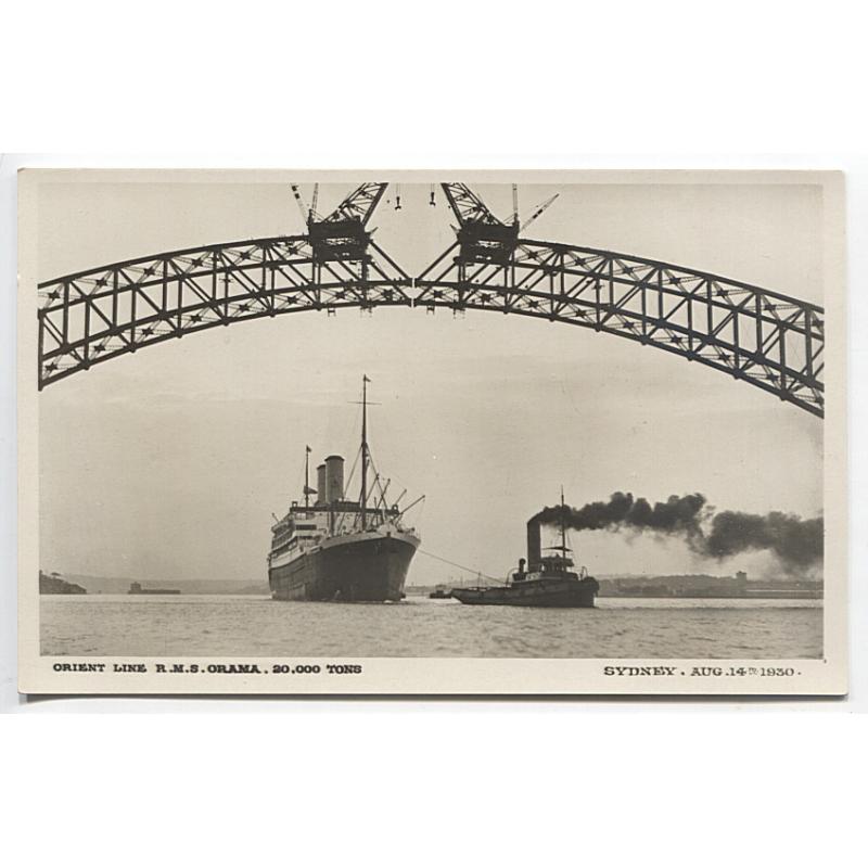 (BB1110) NEW SOUTH WALES · 1930: unused real photo card by E.A. Bradford w/view of the R.M.S. "ORAMA" passing under the nearly joined SYDNEY HARBOUR BRIDGE · VF condition