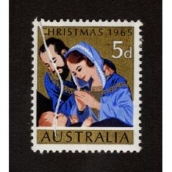 (BB15137) AUSTRALIA · 1965: mint 5d Christmas stamp SG 381 with a significant pre-printing paper crease · short tear along crease at top not readily visible o/wise the stamp is in excellent condition (2 images)