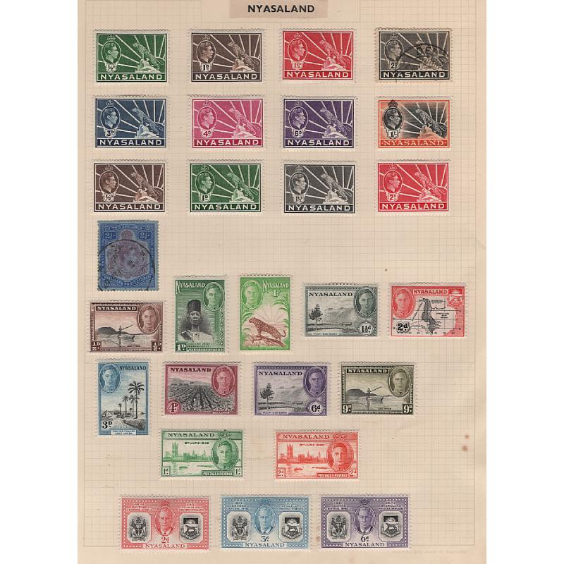 (BB15199L) NYASALAND · 1891/1964: M/U collection on album pages in a mixed condition · from B.C.A. o/prints and includes a fiscally used £1 KGV defin · mainly oddments/mint short sets from KGVI/early QEII era · useful items · 80 stamps (4 images)