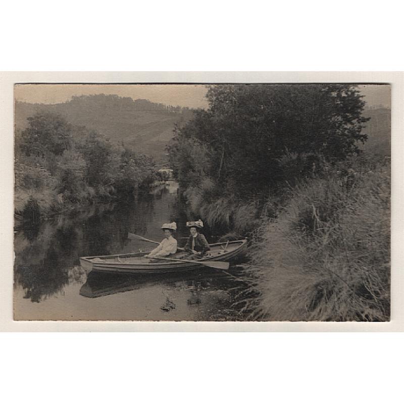 (BB15207) TASMANIA · 1909: real photo card with a portrait of 2 young women messing about in a boat on EGG ISLAND CANAL (Huon River) · postally used from nearby WOODSTOCK with a clear cds pmk · fine condition