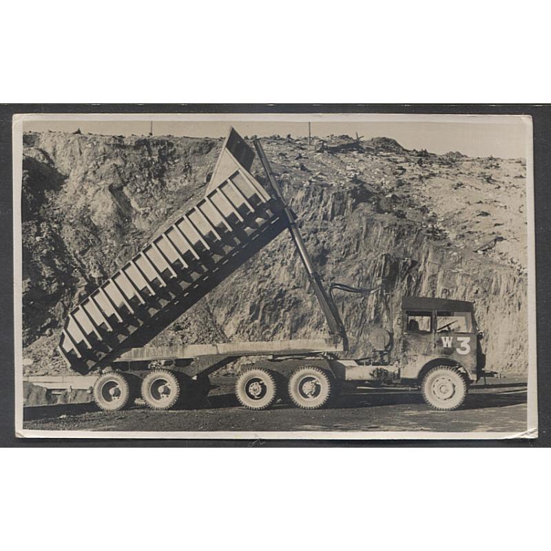 (CD10008) TASMANIA · 1930s: unused real photo card with a view of a huge tip truck with the tray raised in use at the open cut mine at MOUNT LYELL · some corner bends from being mounted in a postcard album o/wise · in excellent condition