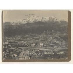 (PG10015L) TASMANIA 1890s: large photo w/view of QUEENSTOWN · newly built "Penghana" at L · affixed to a photo album page ~ also photo of the town taken from the mine manager's residence on back  · both items are in a fine condition (2)