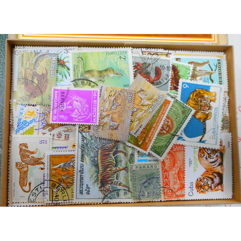 (PL1201B)  WORLDWIDE · wooden cigar box housing an extensive clean accumulation of "ANIMALS" themed stamps ....please view the 4 sample images (many, many, many 100s)