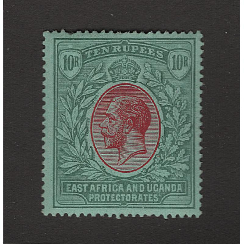 (PR1665) EAST AFRICA AND UGANDA PROTECTORATES · 1912: mint 10R red & green/green KGV defin (Multi Crown/CA wmk) SG 58 · 'pulled perf' in NW cnr o/wise in excellent condition · c.v. £250 (2 images)