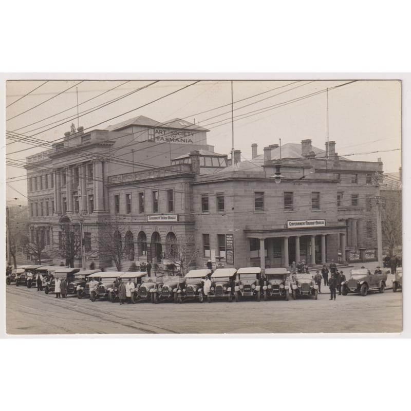 (WW1532) TASMANIA  · 1920s: unused real photo card by J.W. Beattie showing a large fleet of tour vehicles outside the TOURIST BUREAU HOBART · fine condition