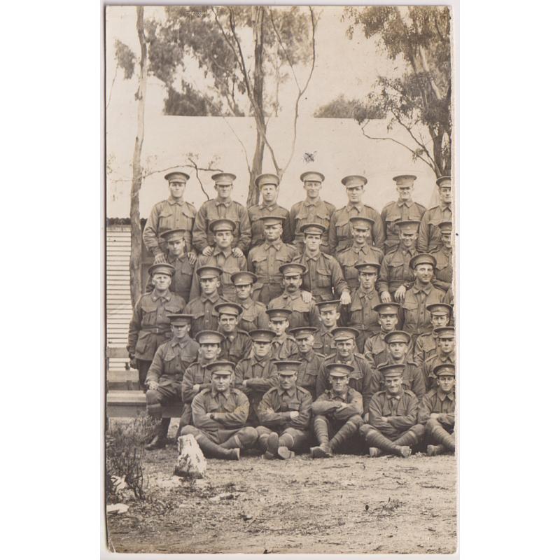 (YY1211) TASMANIA · 1916: postcard size real photo portrait of soldiers taken at CLAREMONT CAMP · it appears that this card is only part of a larger portrait · some paper adhesions on verso o/wise in excellent condition